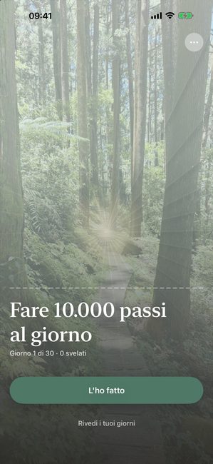 L'app Reveal the Dream che mostra una foto di un bosco completamente coperta al primo giorno di un percorso di trenta giorni per fare 10.000 passi al giorno.