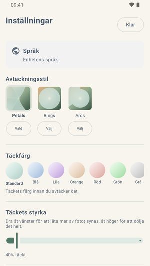 Inställningsskärmen med avtäckningsstilarna, en rad med sju täckfärger och ett reglage för täckets styrka.