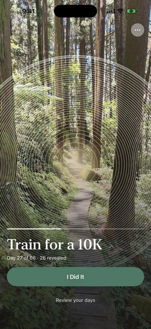 The app showing a woodland photo partly uncovered in concentric rings, on day 27 of a sixty six day running journey.